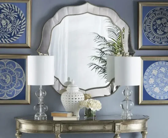 Elegant mirror with lamps and blue art pieces